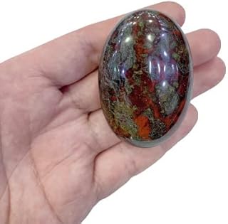 Oval stone of physical onis palm crystal therapy, energy massage and hydrotherapy stone (dragon blood).. DIAYTAR NIGERIA: Bringing quality products to your doorstep at prices that won't break the bank.
