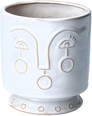 Small white ceramic flower pot beela graham with face printing.. DIAYTAR NIGERIA delivers more than products - we deliver affordable shopping satisfaction nationwide.
