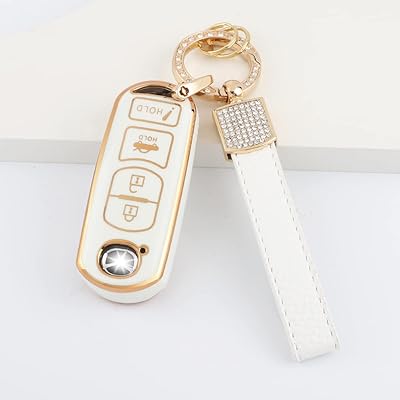 Car key cover 1797 in white and gold thermoplastic polyurethane.. DIAYTAR NIGERIA: Where quality meets affordability, with thousands of products delivered in less than 8 days.