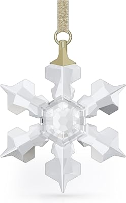 Star charm to hang in the shape of a Swarovski snowflake, transparent crystals, from the Little Snow Flake collection.. Discover the perfect balance of selection and value with DIAYTAR NIGERIA's nationwide delivery service.