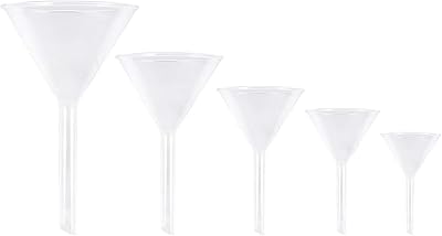 Small funnel in transparent glass with large mouths, filler for filling bottles to fill bottles of water, spices, liquid powder, aromatic perfume, laboratory.. Discover a new way to shop with DIAYTAR NIGERIA's comprehensive marketplace and quick delivery options.