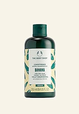 Truly nourishing post-shampoo for banana for dry vegan hair, subjects to frizz and damage, last external design 250 ml of the body shop.. DIAYTAR NIGERIA: Simplifying access to thousands of products with affordable nationwide shipping.