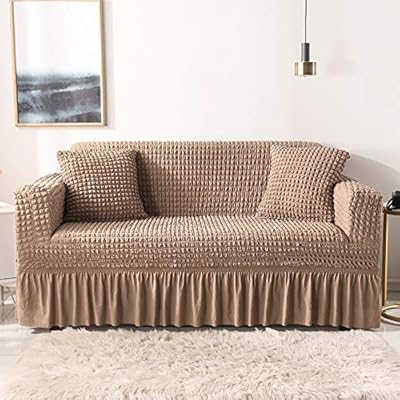Universal expandable sofa cover all inclusive anti-dust cover with ruffles.. DIAYTAR NIGERIA brings the market to your screen with thousands of affordable products delivered to your door.