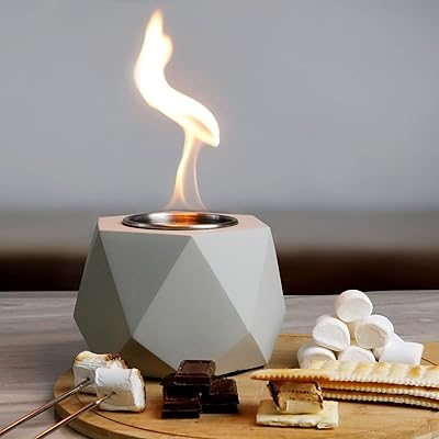 Rustic mini table in concrete household with smoke for smores.. DIAYTAR NIGERIA delivers on our promise of variety, affordability, and prompt nationwide shipping.