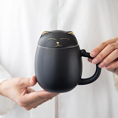 The White Shop ceramic tea cup with infuser and lid, cute cat tea cup with infuser filter with mobile leaves. (black).. Discover the convenience of DIAYTAR NIGERIA's vast e-commerce platform with delivery in just 5-8 days.