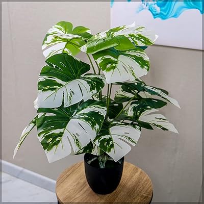 Yatai artificial monstera tree about 60 cm high with plastic pot.. DIAYTAR NIGERIA connects your desires with reality through our affordable e-commerce platform and quick delivery.
