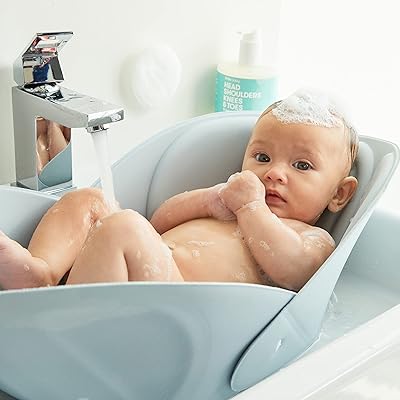 Frida Baby Soft bathtub, easy to clean with a bath pillow to support baby's head, white color, suitable for children.. Whether you're in Lagos, Abuja, or anywhere in between, DIAYTAR Nigeria ensures your online shopping experience is smooth, affordable, and fast.