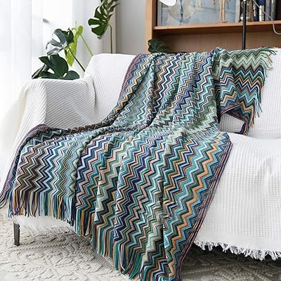 Bohemian sofa cover, soft and respectful of the skin with pompom (50 "x 60").. DIAYTAR NIGERIA: Making quality accessible to all Nigerians with affordable prices and quick delivery.