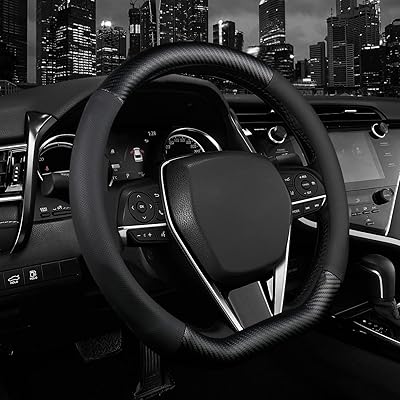Volant cover, luxury leather car steering wheel protector, sports carbon fiber design, non-slip and breathable, universal 15-inch car/SUV adjustment, flat ruffles (shiny black).. Find quality and variety without breaking the bank — only on DIAYTAR Nigeria.