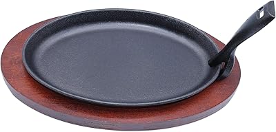 Fajita stove in cast iron oval shape of 27 cm with handle and wooden base.. Shop for everything you need at DIAYTAR NIGERIA, with budget-friendly prices and quick delivery.