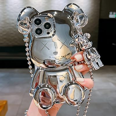 A pretty shell in the shape of an artificial t-shirt for iPhone 13 pro max, brilliant silver cartoon bear pattern with metal chain bracelet and bell collar (silver bear).. Experience shopping freedom with DIAYTAR NIGERIA's comprehensive marketplace delivered within 8 days.