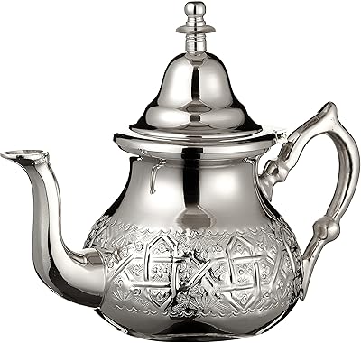 A Moroccan teapot in silver ideal for mint tea. Includes a handle cover and an original integrated filter. Classic design engraved by hand. Very large capacity of 1 liter, or about 8 cups of tea... DIAYTAR NIGERIA: Where every shopping need is met with affordable prices and timely delivery.