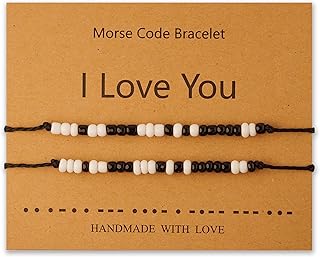 Friendship bracelet adjustable in handmade pearls with pink pompoms in Morse code, 2 pieces.. DIAYTAR NIGERIA: Empowering Nigerians with access to affordable products delivered within 8 days.