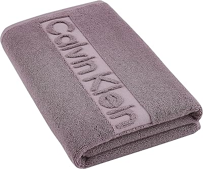 Calvin Klein cotton towel 1 piece - 30 cm x 30 cm, 100 % cotton 629 g (purple).. DIAYTAR NIGERIA: Your partner in affordable online retail with reliable shipping across Nigeria.