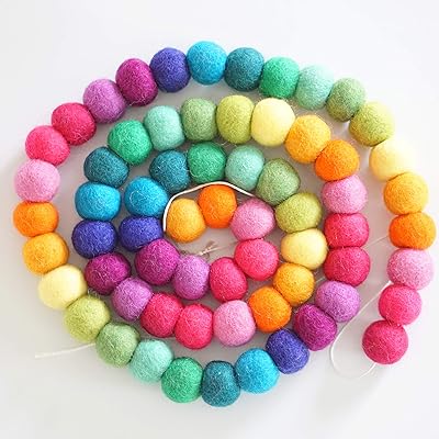 Decomode garland of 100 % wool felt pompoms, length 152 cm, 65 balls-large (sparkling rainbow).. DIAYTAR NIGERIA transforms online retail with our affordable platform and dependable shipping service.